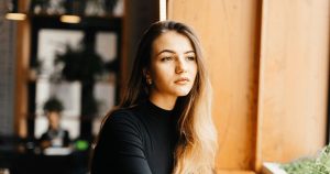 Woman reflecting on her emotions and healing journey after an abortion.