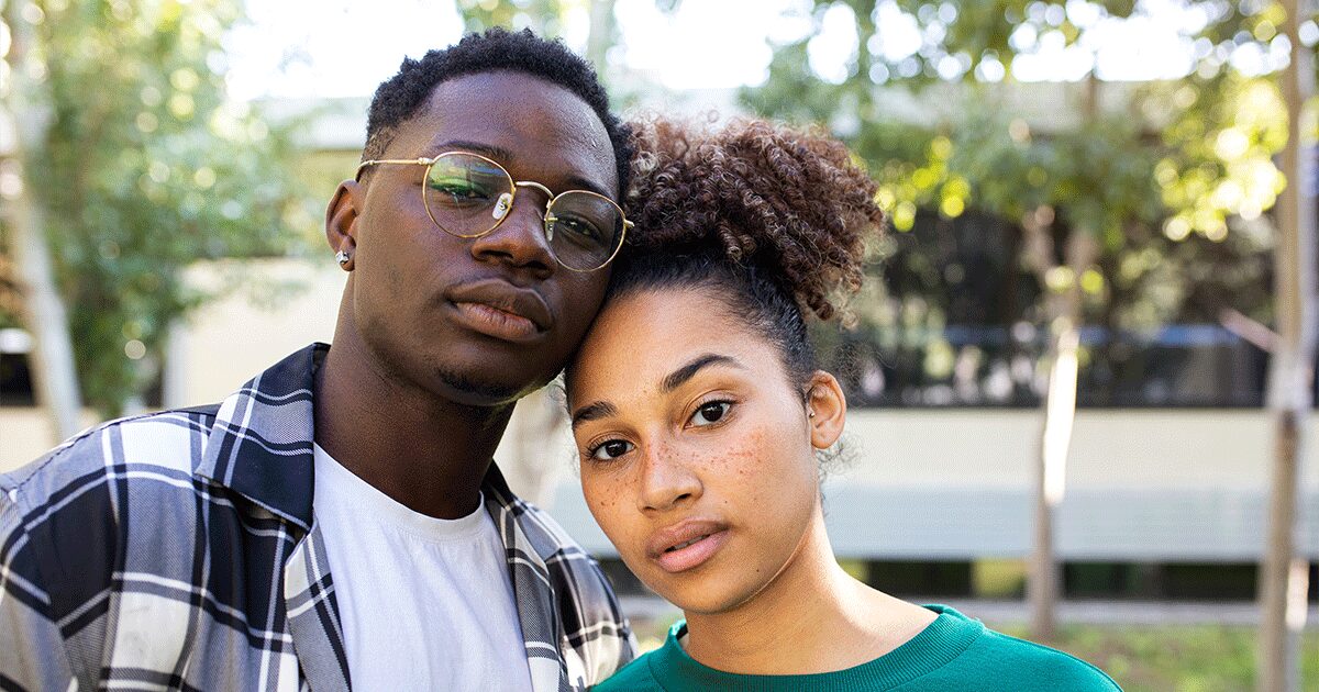 Young woman feeling uncertain while facing pressure from her partner about an unexpected pregnancy.